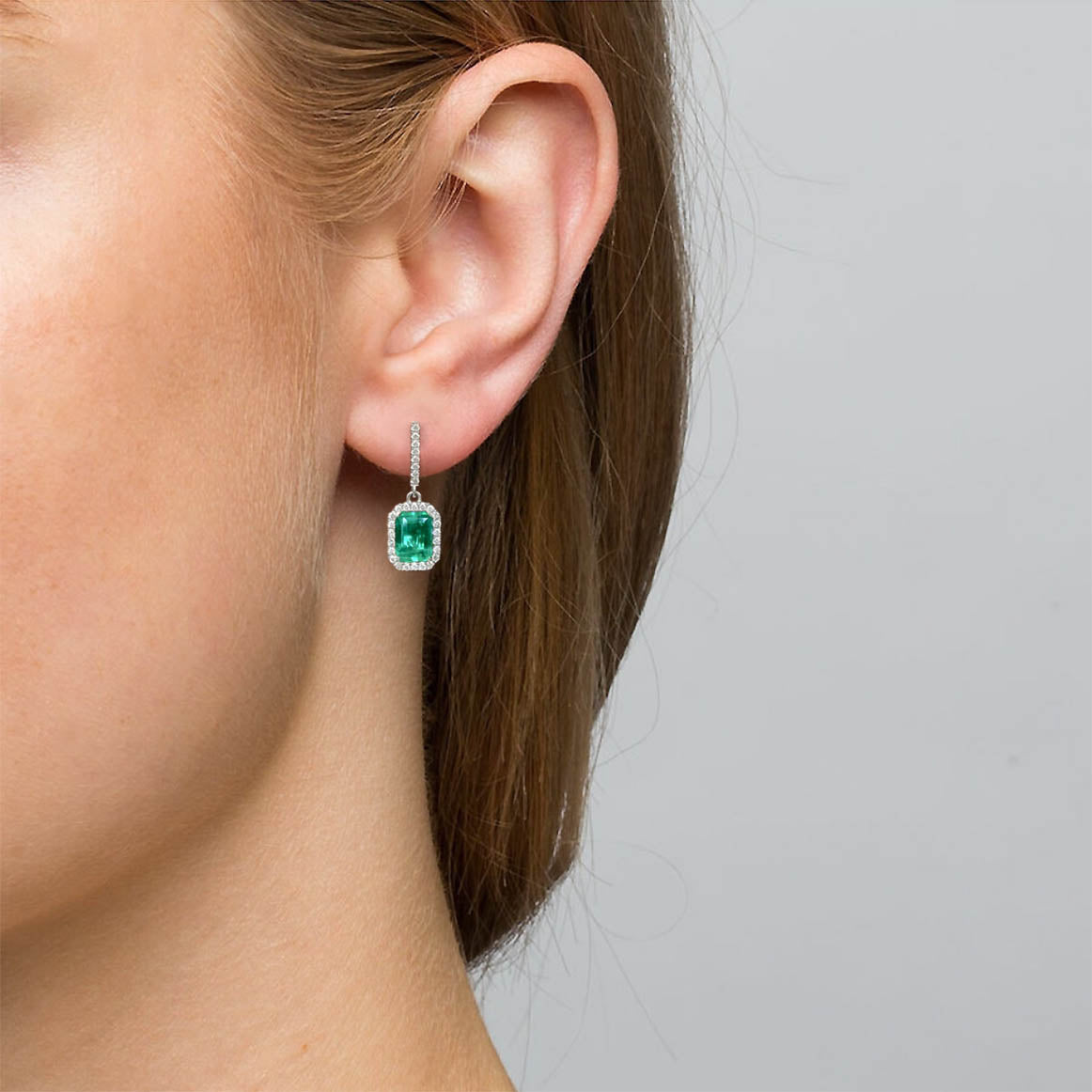 1.28ct emerld drop earrings with diamonds in 18k white gold on model