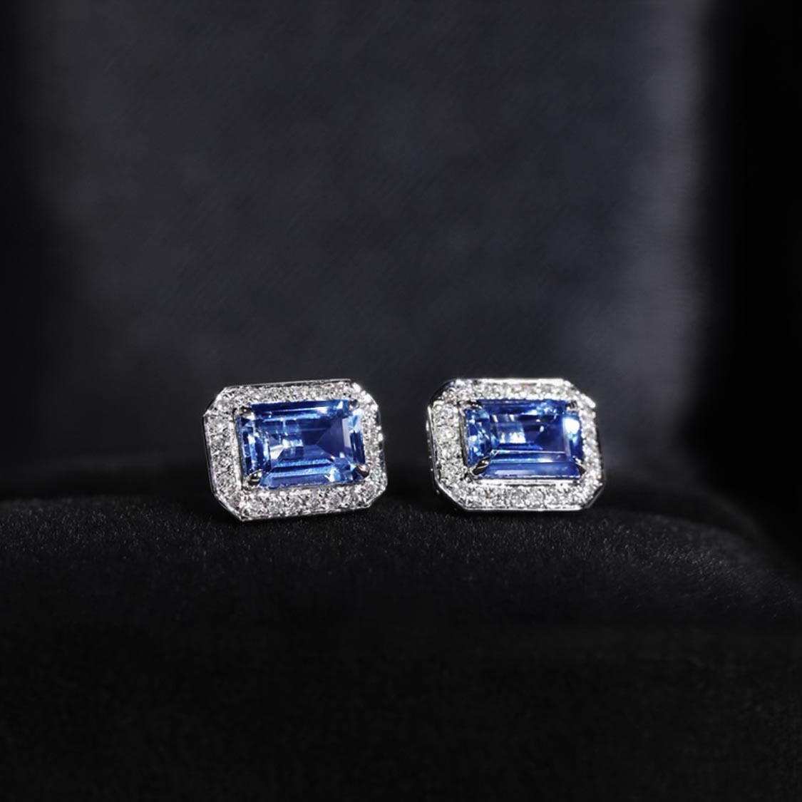 one of a kind sapphire earrings with diamond halo 18k white gold side