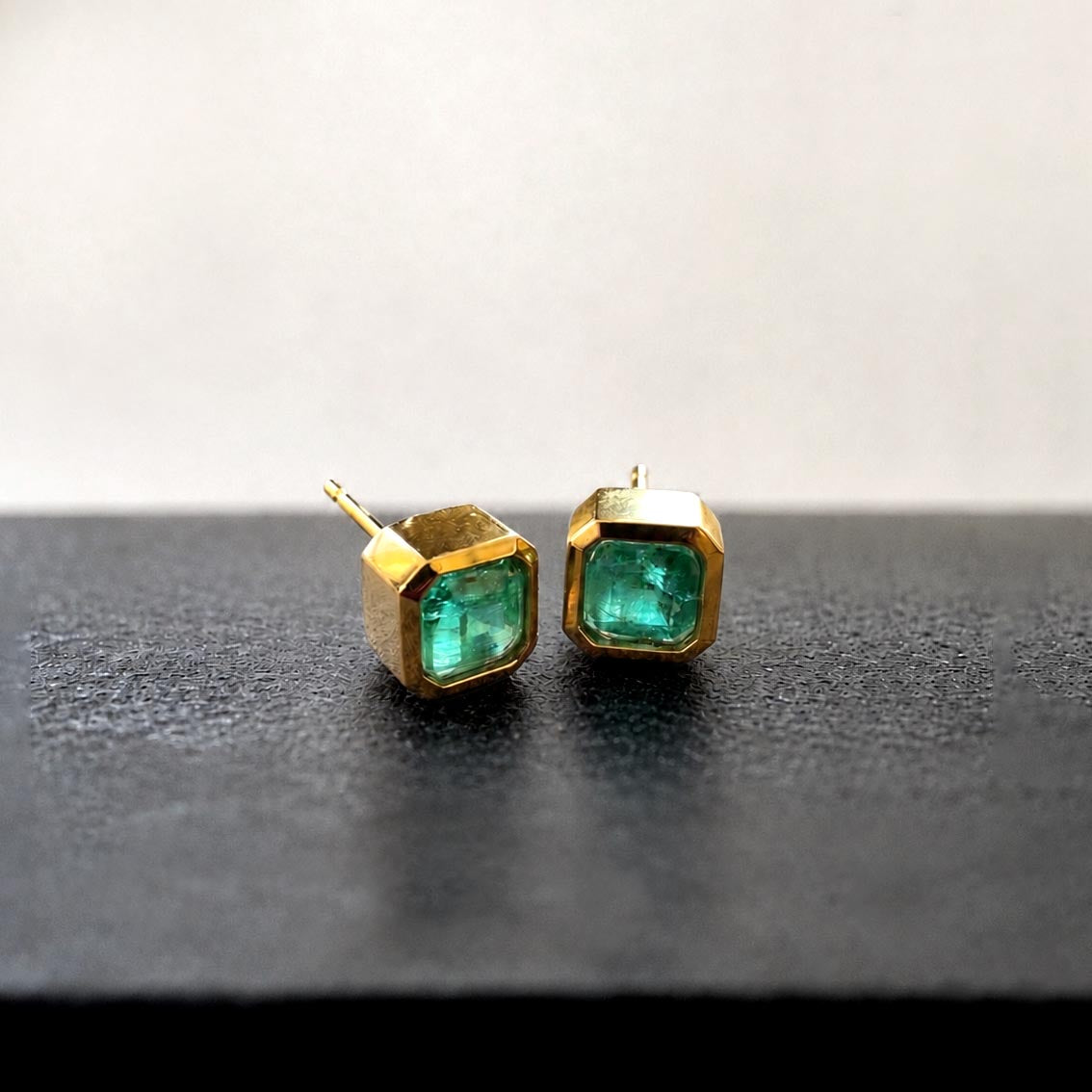 1.01ct bezel set asscher cut emerald earrings in 18k gold