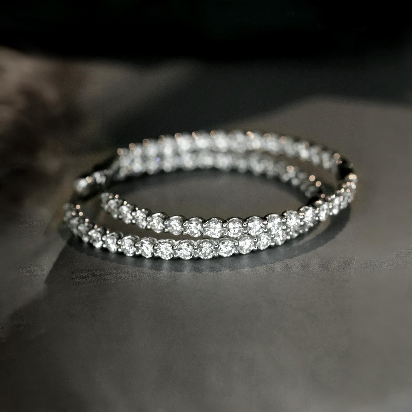 embrace 3.9ct diamond hoop earrings in 18k whte gold on table
