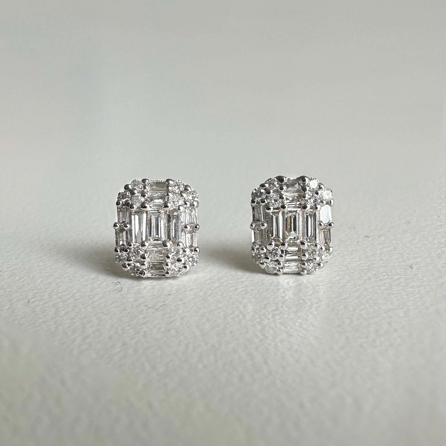 emerald shaped diamond earrings 18k white gold front view