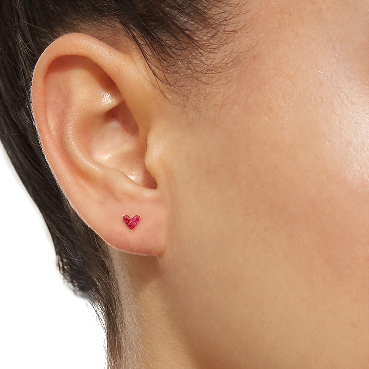 0.35ct ruby by heart earrings 18k gold on ear