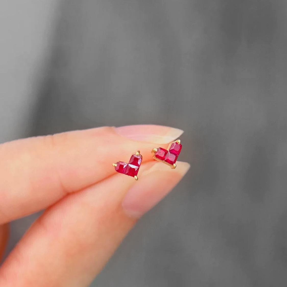 0.35ct ruby by heart earrings 18k gold on hand