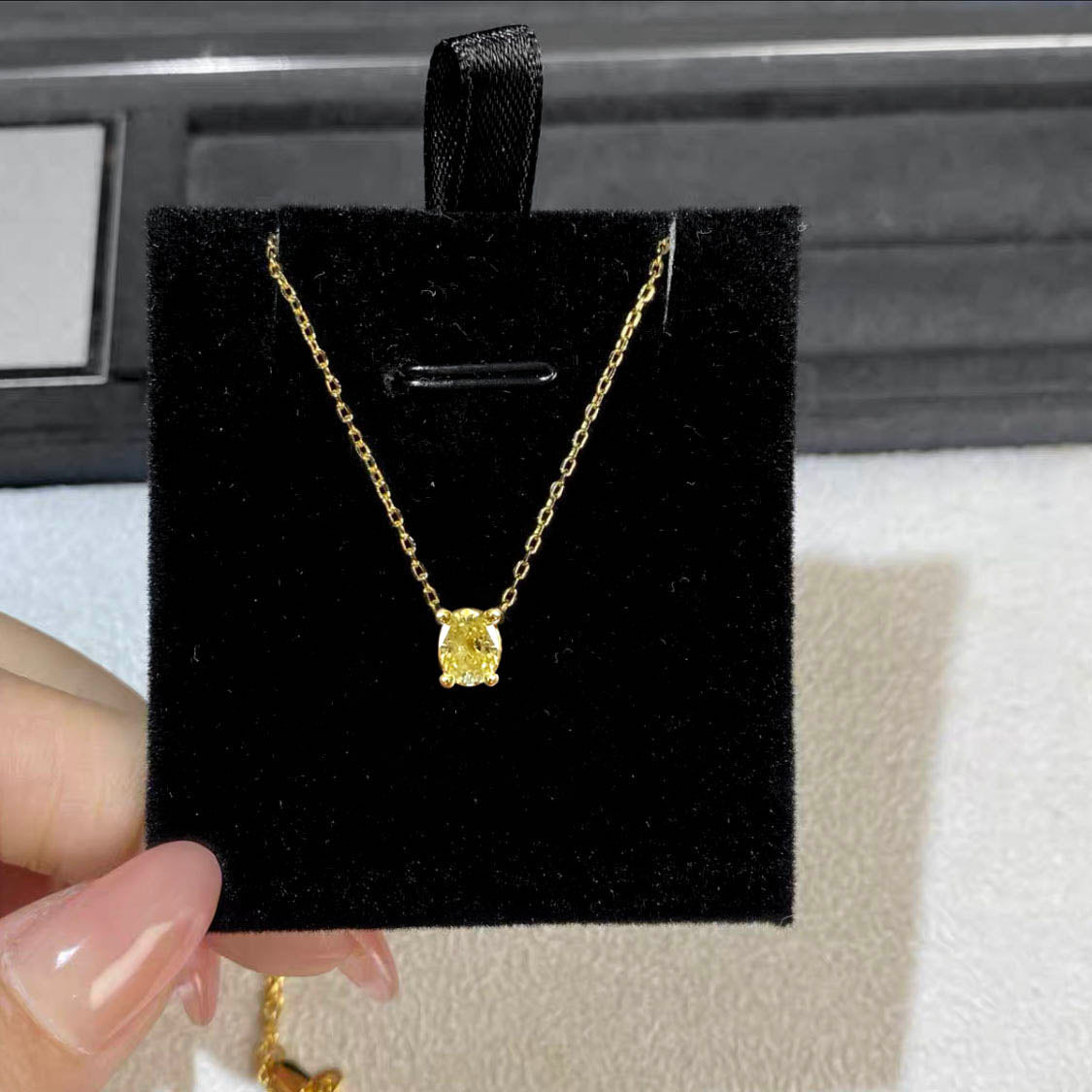 0.3ct oval cut yellow diamond necklace in 18k gold