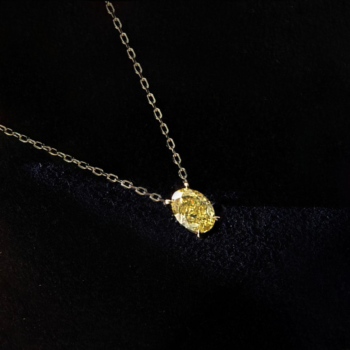 0.5ct oval cut yellow diamond necklace in 18k gold