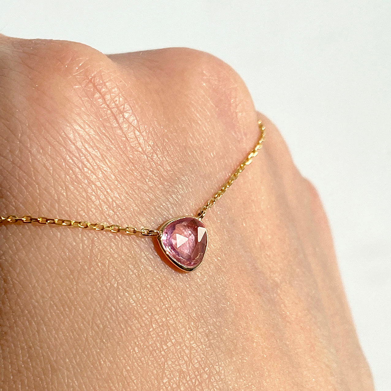 love more pink sapphire necklace 18k gold on hand