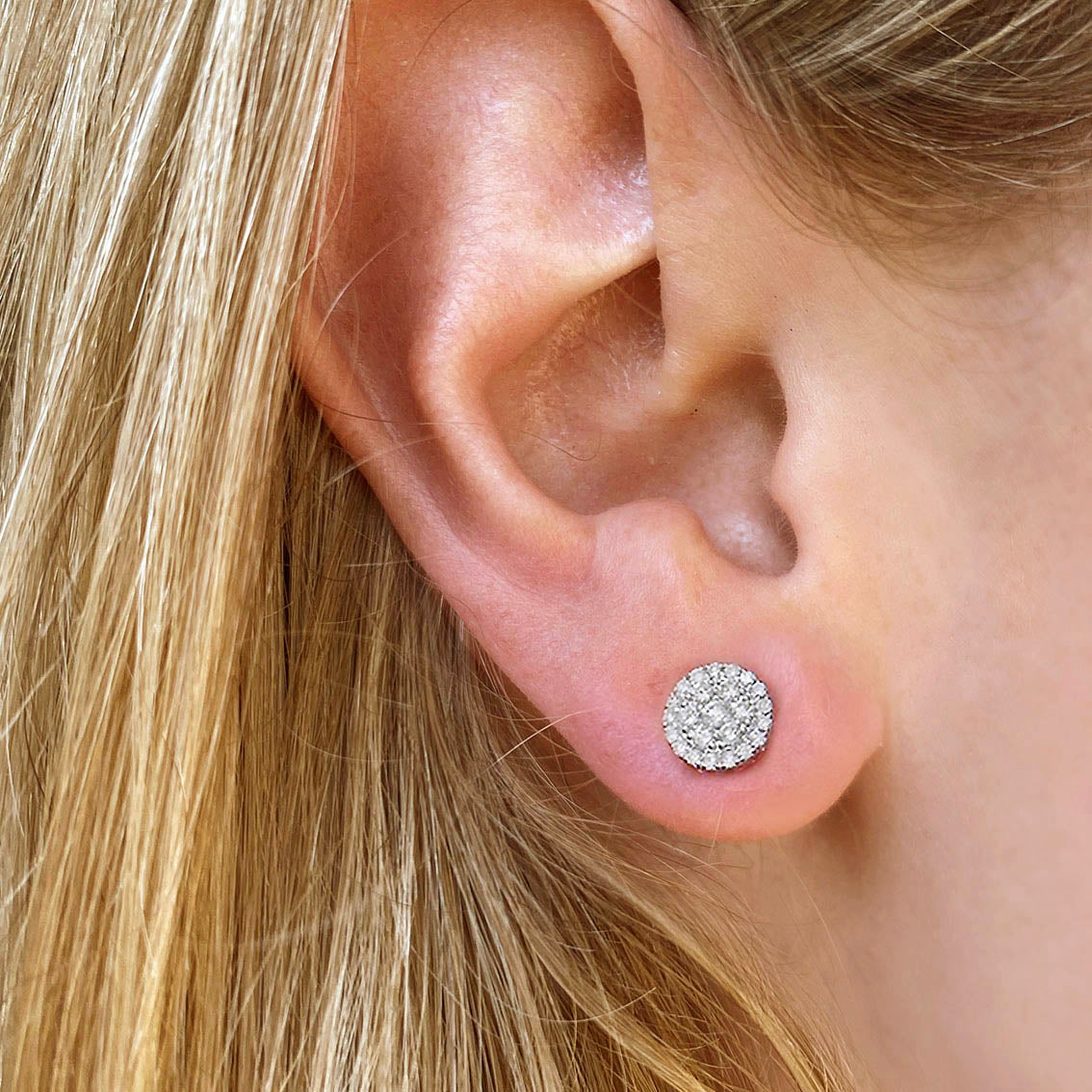 round diamond cluster earrings 18k white gold on ear