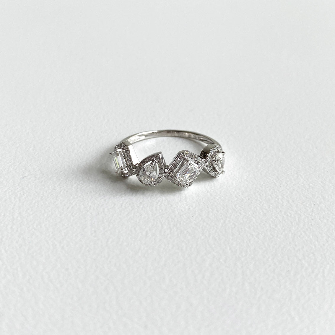 teide mixed-cut diamond ring in 18k white gold on table