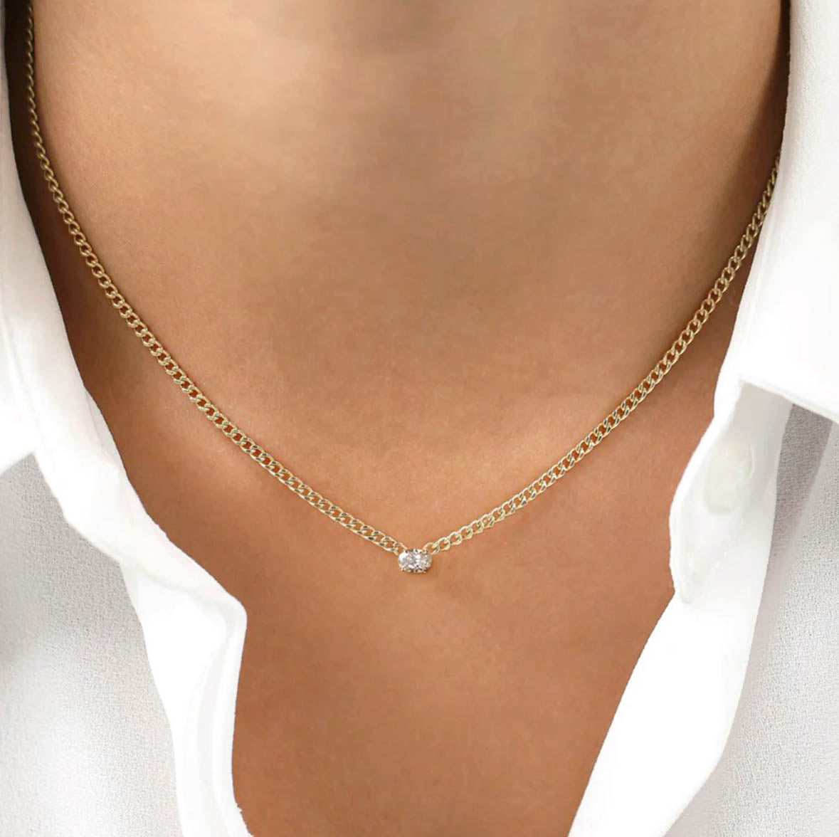 0.20ct oval diamond cuban link necklace in 18k gold on neck