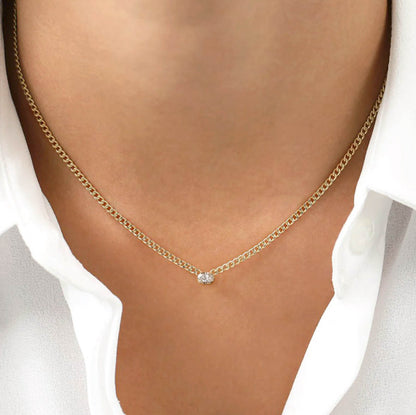 0.20ct oval diamond cuban link necklace in 18k gold on neck