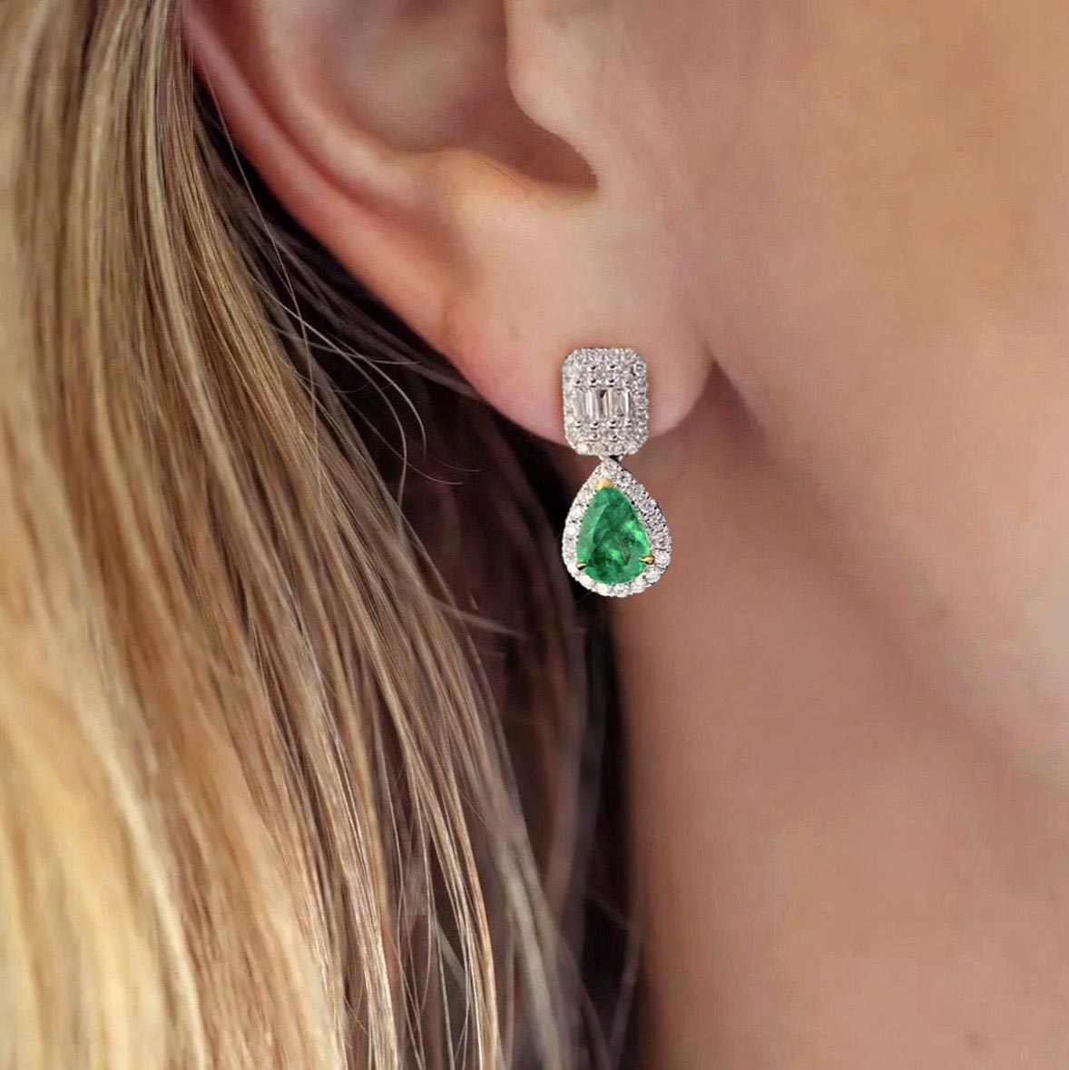 1.05ct emerald diamond earrings in 18k white gold on ear