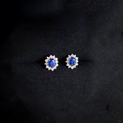 snowflake diamonds and sapphires earrings in 18k white gold on ear