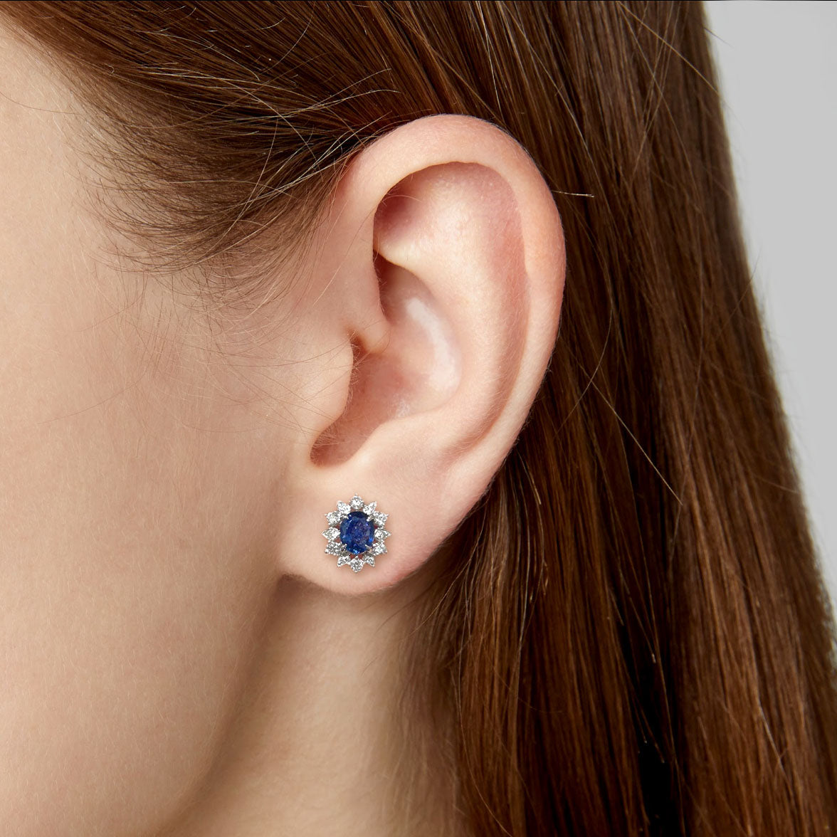 snowflake diamonds and sapphires earrings in 18k white gold on ear