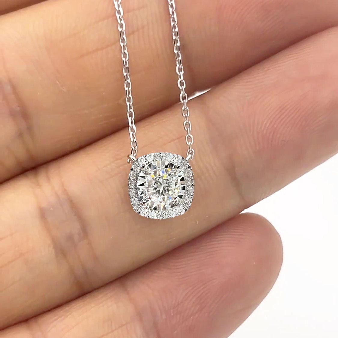 embrace 0.15ct cushion halo diamond necklace in 18k white gold on hand