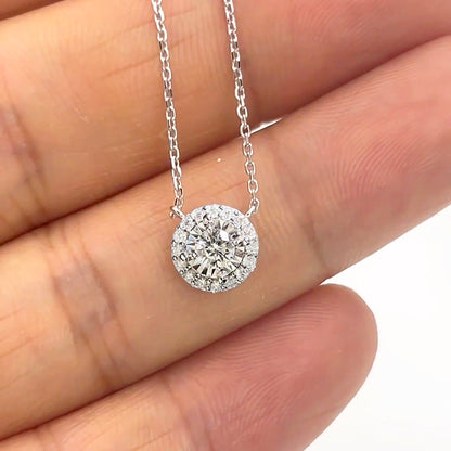 embrace 0.15ct round halo diamond necklace in 18k white gold on hand