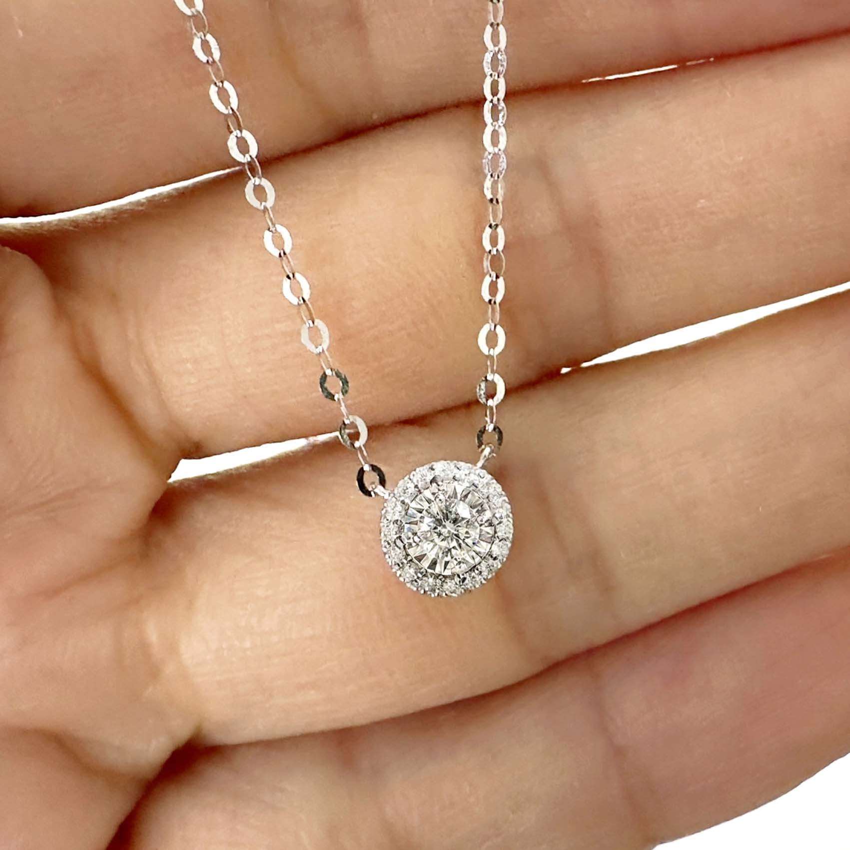 embrace 0.15ct round halo diamond necklace in 18k white gold on hand
