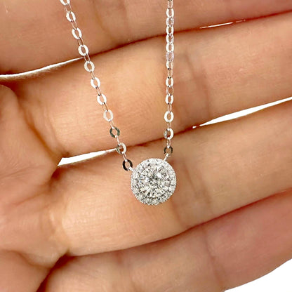 embrace 0.15ct round halo diamond necklace in 18k white gold on hand
