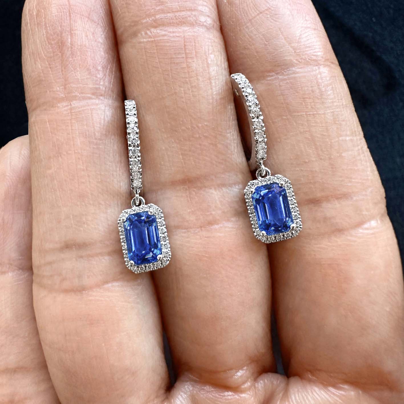1.7ct sapphire and diamond drop earrings in 18k white gold on hand