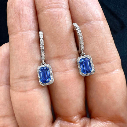1.7ct sapphire and diamond drop earrings in 18k white gold on hand