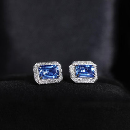one of a kind sapphire earrings with diamond halo 18k white gold side