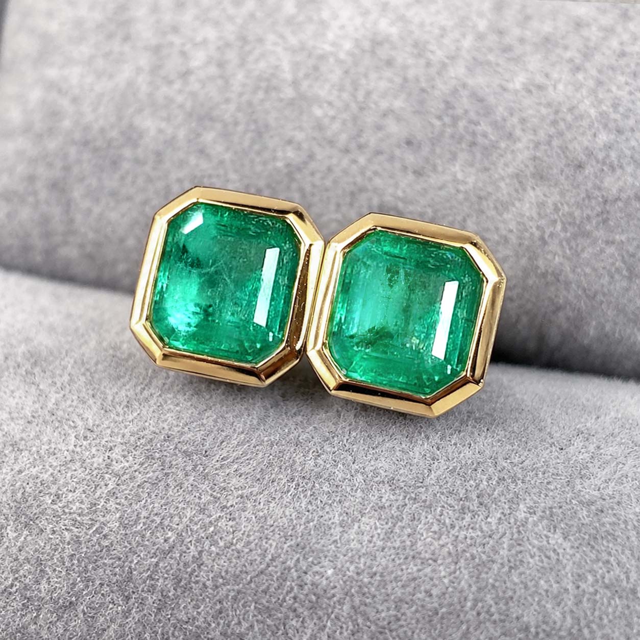 1.01ct bezel set asscher cut emerald earrings in 18k gold