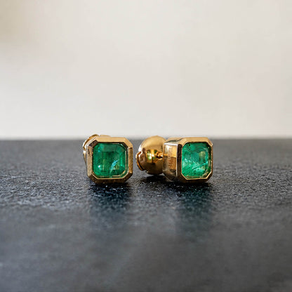 1.01ct bezel set asscher cut emerald earrings in 18k gold
