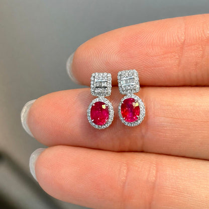 1.0ct ruby earrings with diamonds in 18k white gold on hand