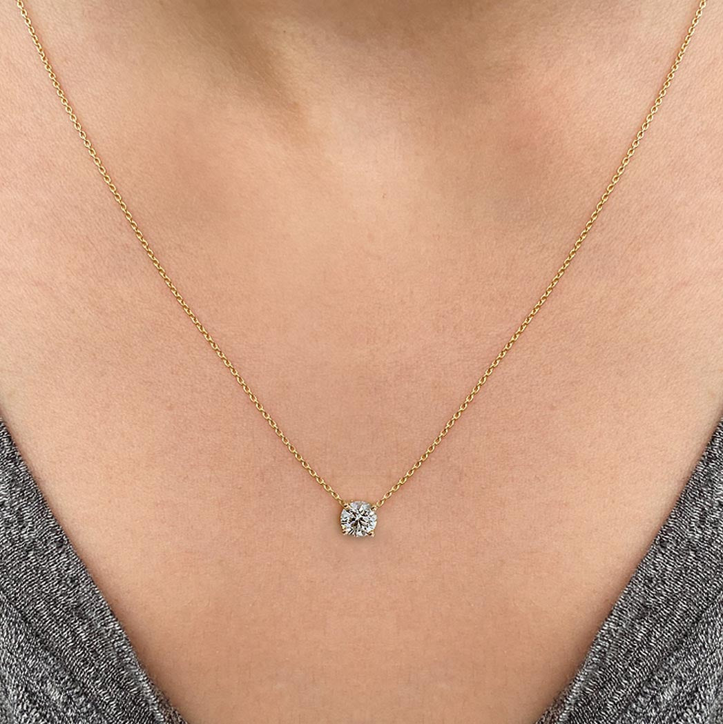 embrace 0.5ct diamond necklace in 18k gold on neck