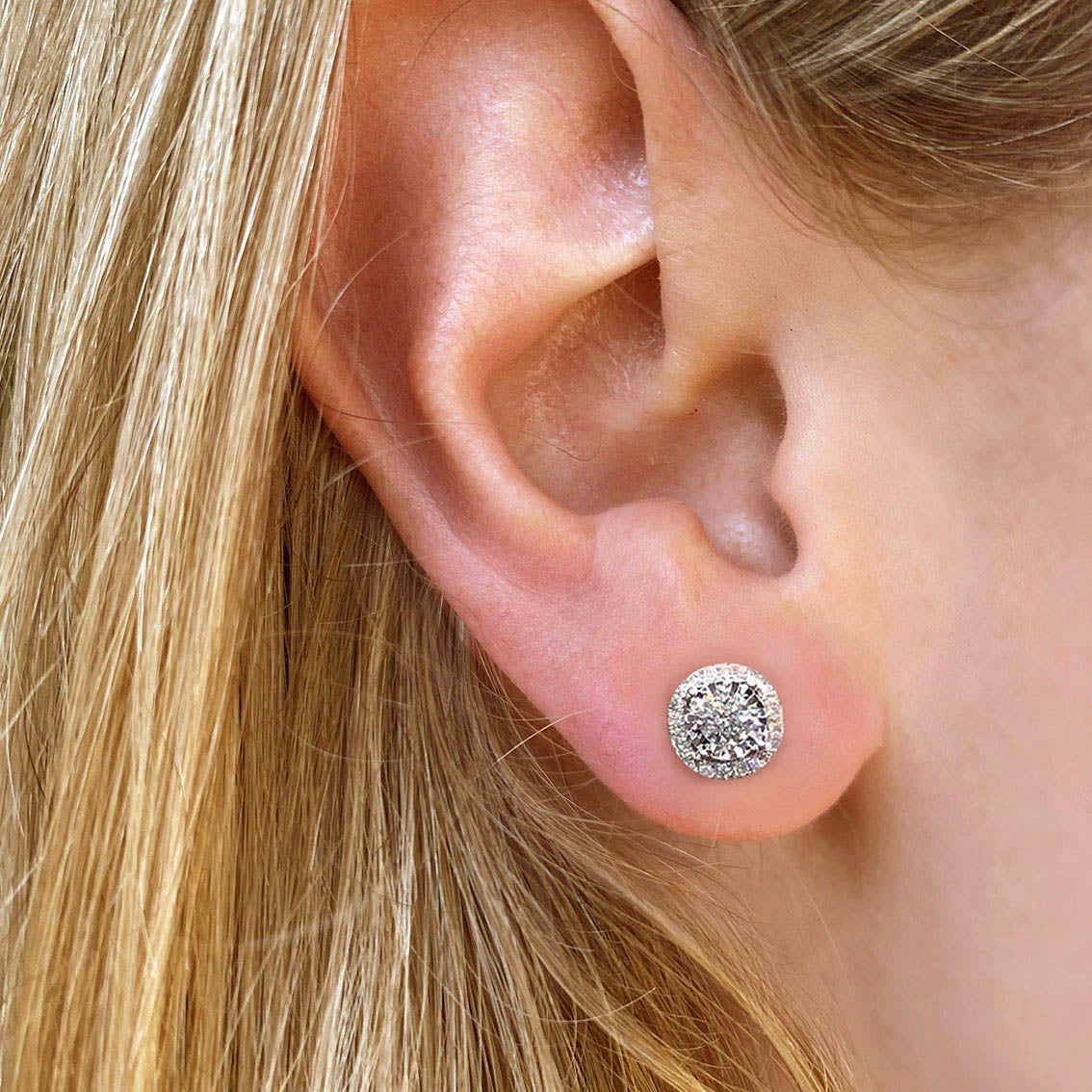 embrace 0.5ct round diamond halo earrings in 18k white gold on ear