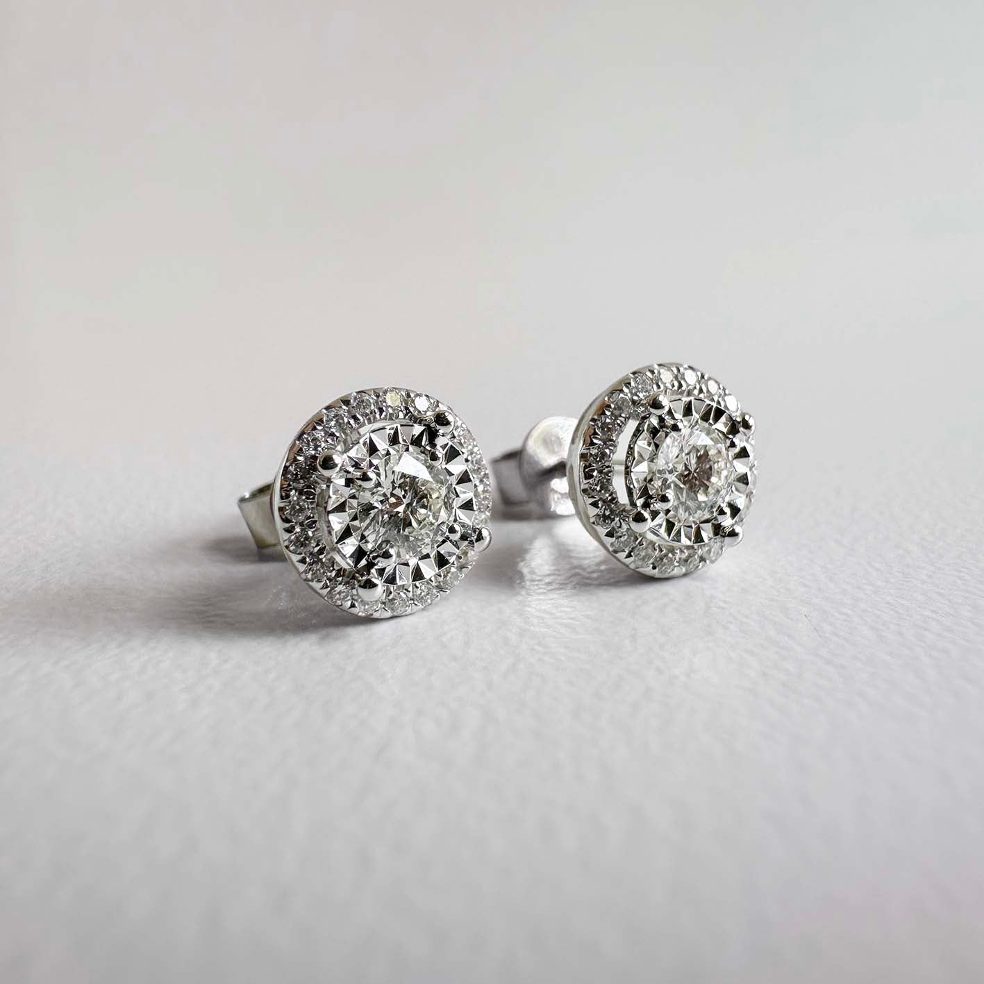 embrace 0.5ct round diamond halo earrings in 18k white gold side view