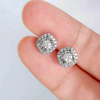 0.54ct cushion diamond halo earriings in 18k white gold on hand