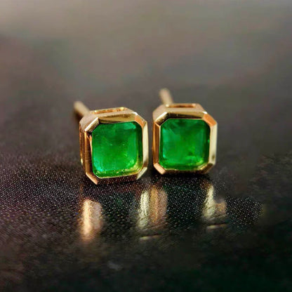 0.87ct bezel set asscher emerald earrings in 18k gold