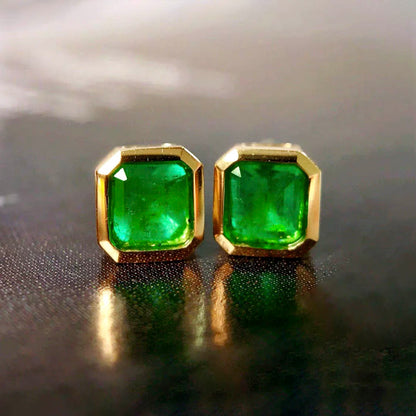 0.87ct bezel set asscher emerald earrings in 18k gold