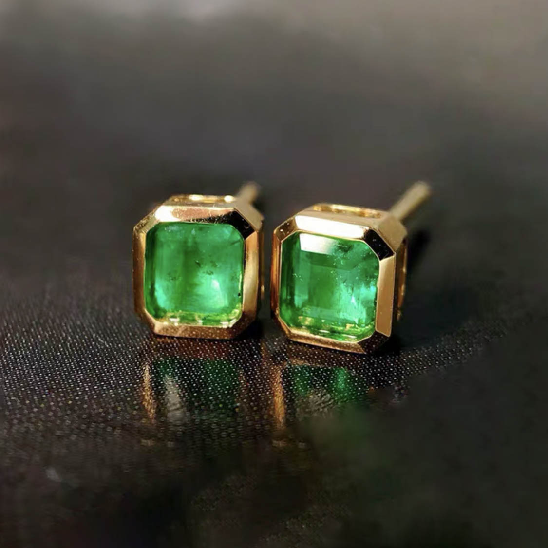 0.87ct bezel set asscher emerald earrings in 18k gold