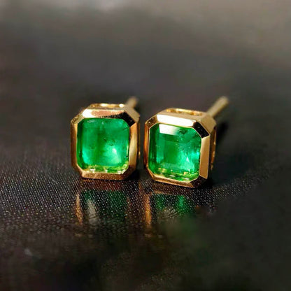 0.87ct bezel set asscher emerald earrings in 18k gold