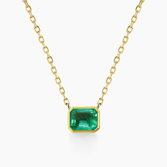 bezel set emerald necklace in 18k gold