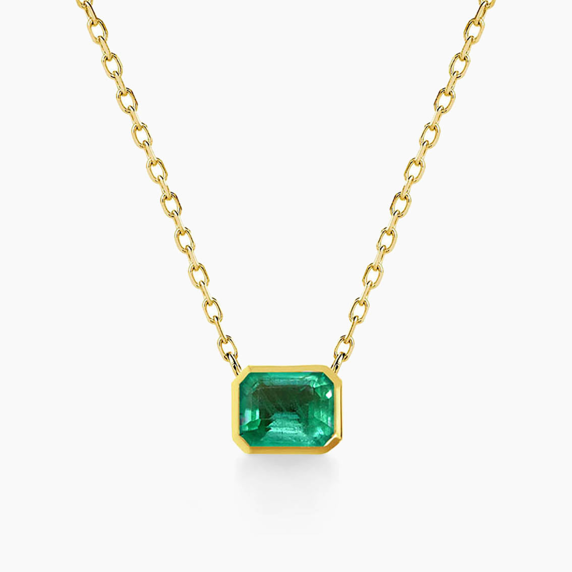 bezel set emerald necklace in 18k gold