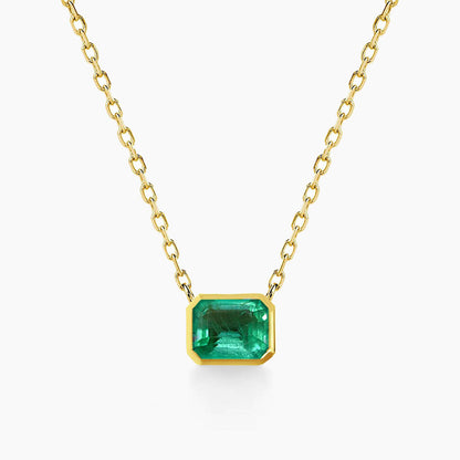 bezel set emerald necklace in 18k gold