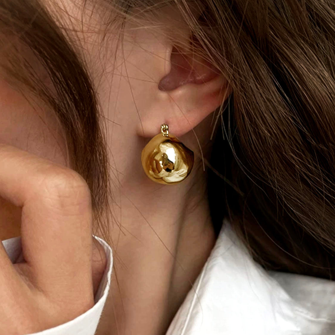 jullie big bll earrings in 18k gold plated sterling silver on ear