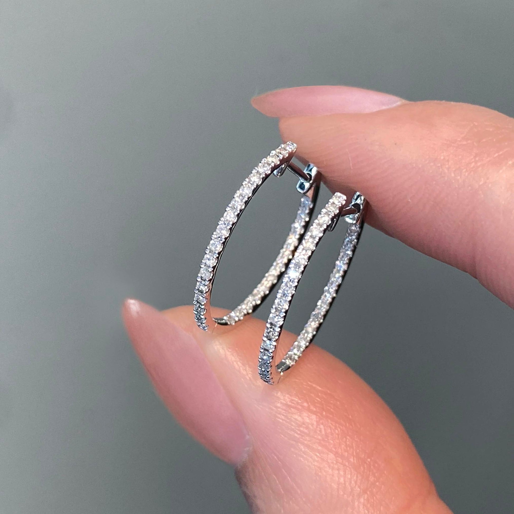 embrace 0.6ct diamond hoop earring in 18k white gold on hand