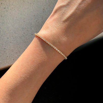 embrace 2ct diamond tennis bracelet in 18k gold on hand