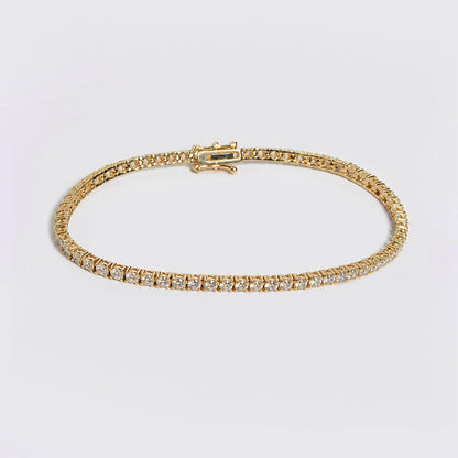 embrace 2ct diamond tennis bracelet in 18k gold on table