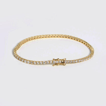 embrace 2ct diamond tennis bracelet in 18k gold on table