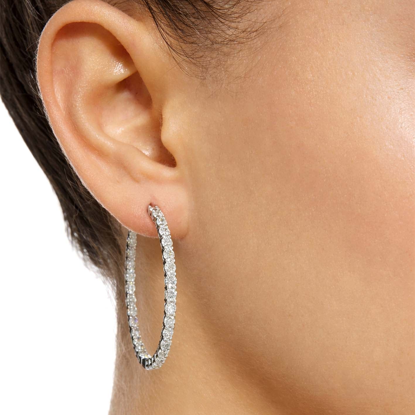embrace 3.9ct diamond hoop earrings in 18k whte gold on ear