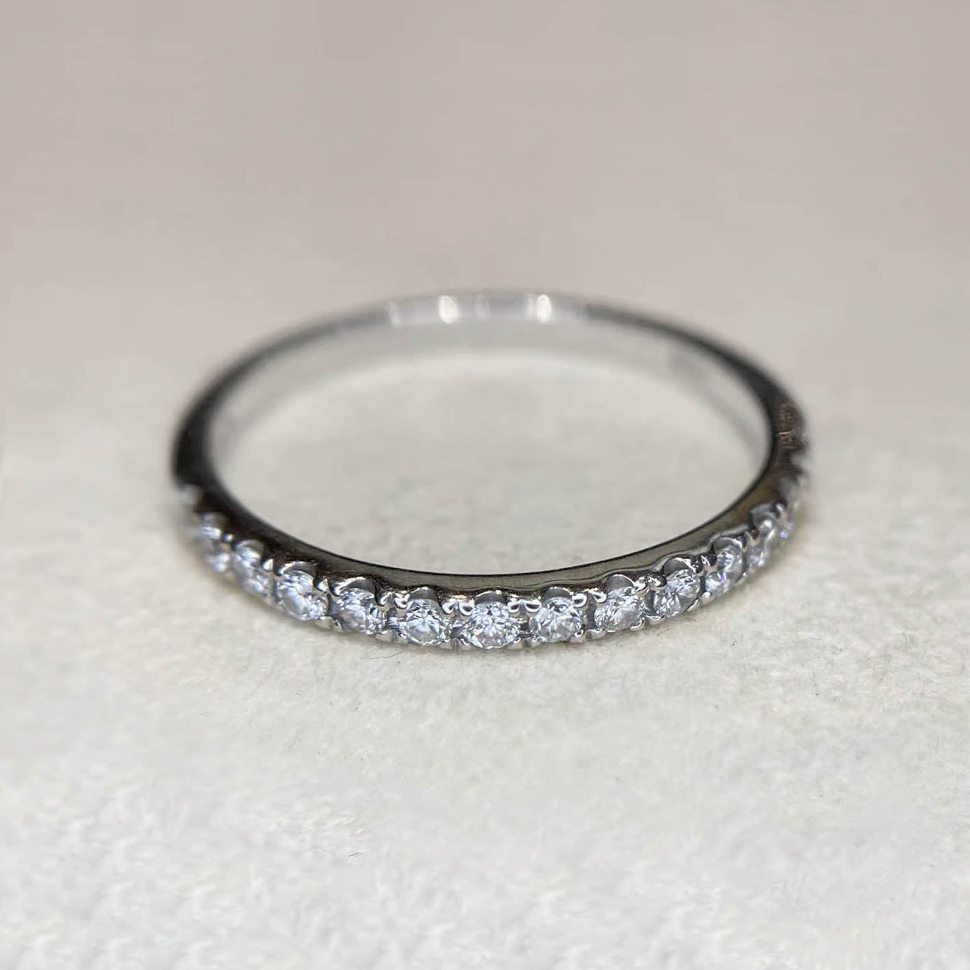 embrace 0.3ct half eternity ring 18k white gold on table