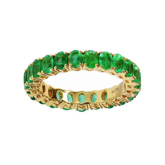 3.0ct oval cut emerald eternity ring in 18k gold