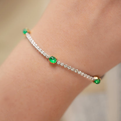 emerald diamond tennis bracelet in 19k white gold on arm