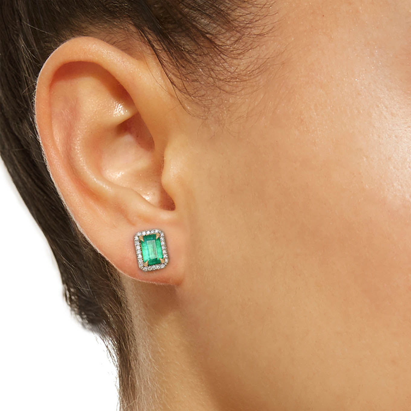 emerald earrings diamond halo in 18k white gold on ear