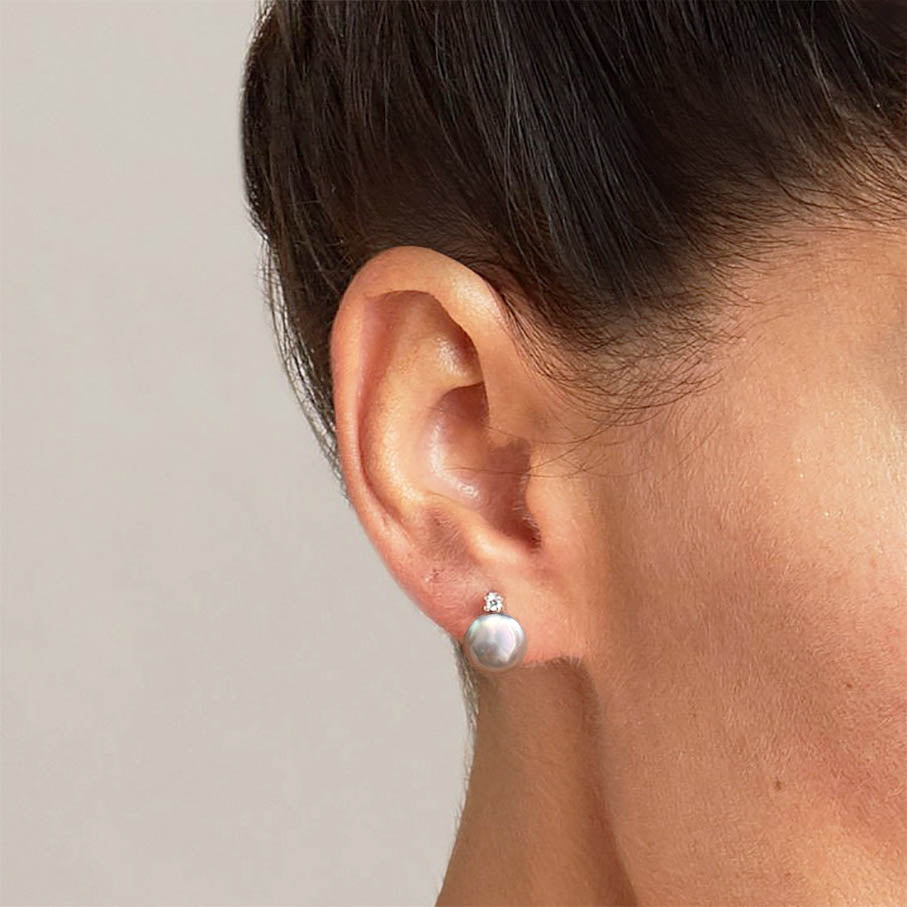 grey akoya pearl diamoon earrings in 18k white gold on ear