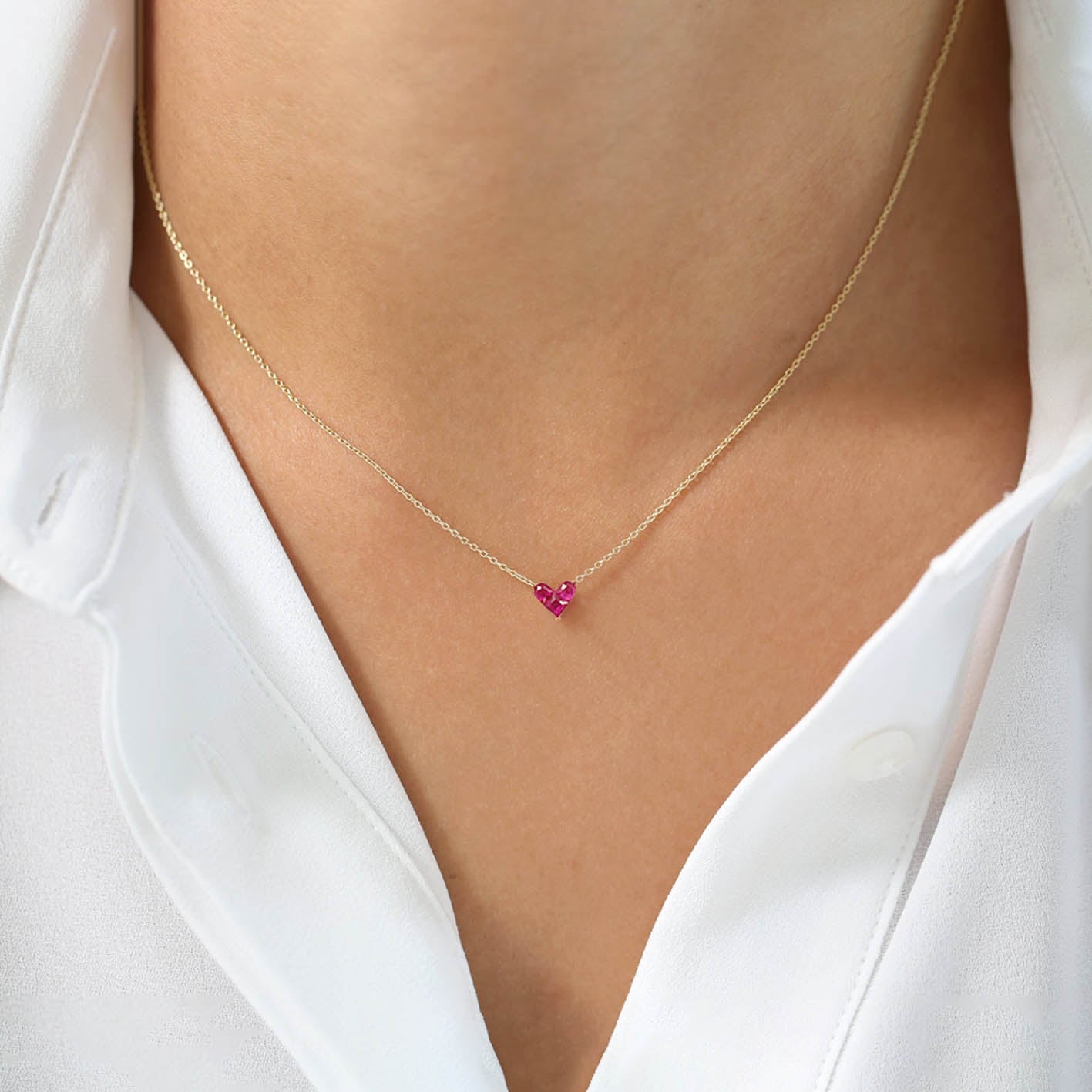 0.27ct ruby by heart necklace 18k gold on neck